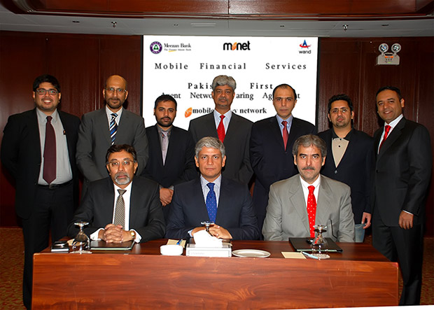 Meezan Bank’s Chief Operating Officer, Mr. Ariful Islam, Warid Telecom’s Chief Commercial Officer, Mr. Younas Iqbal Sheikh and Monet’s Chief Executive Officer, Mr. Ali Abbas Sikander sign Pakistan's first Agent network sharing for Meezan Bank's branchless banking.